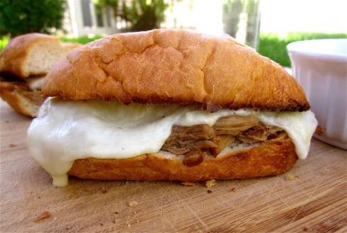 IMG_4164 French dip sandwich on cutting board with melted cheese.