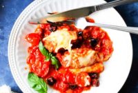 Veal Rollatini Stuffed with Peppers, Cheese, and Basil in a Rich Tomato Olive Sauce