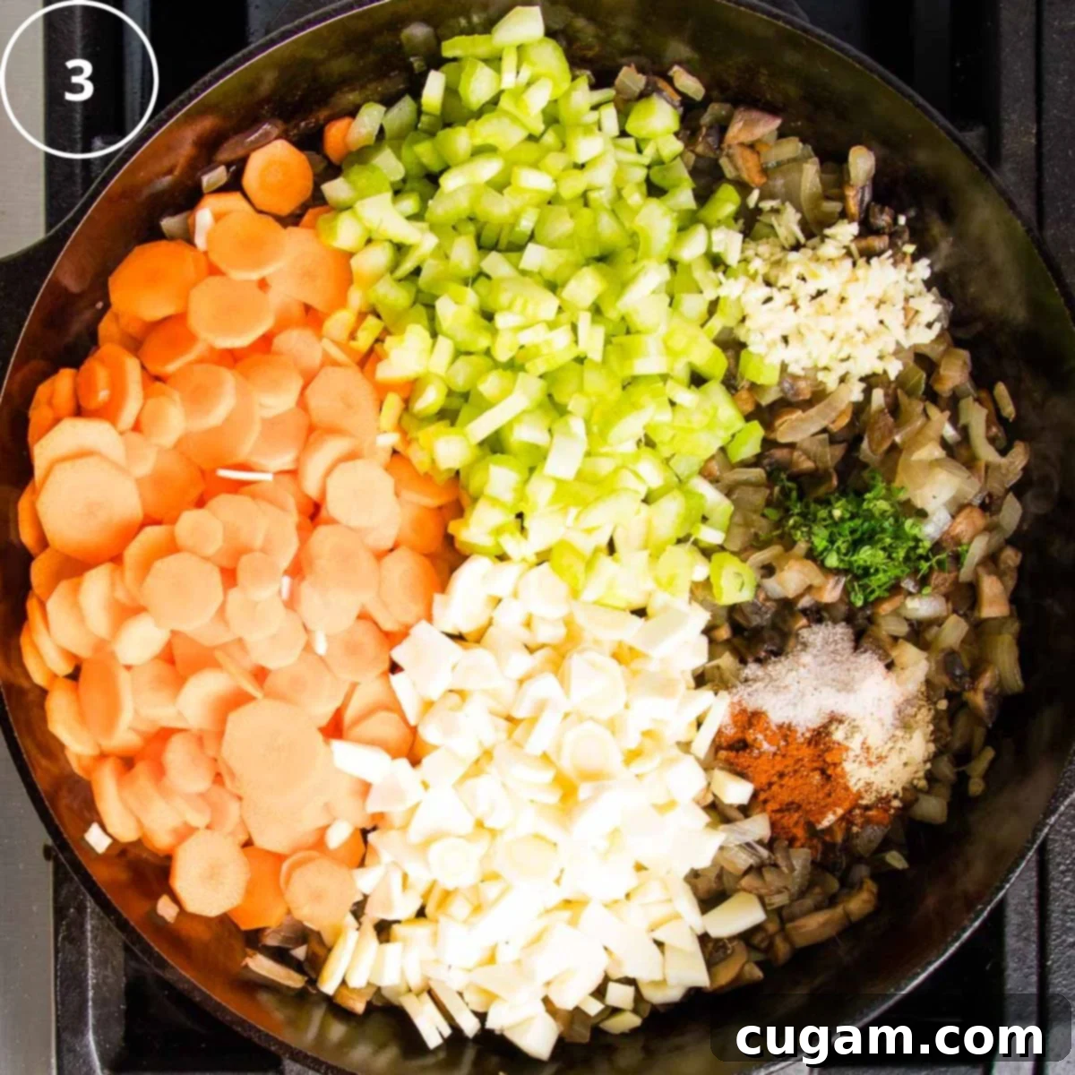 Sections of chopped carrots, parsnips, celery, sauteed onions and mushrooms, plus spices and herbs in a cast iron skillet. 