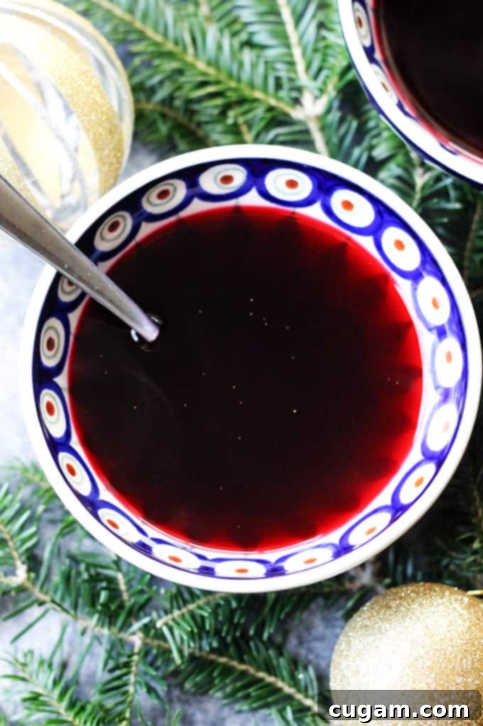 Borscht in a bowl with spoon and Christmas decoration
