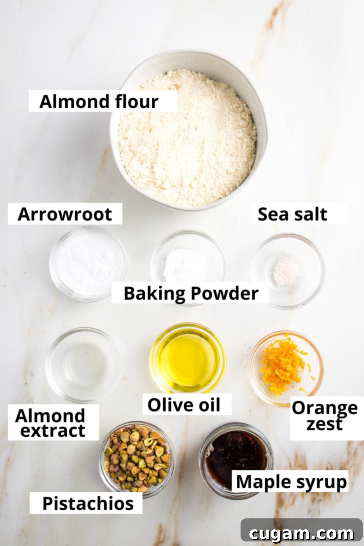 Labeled ingredients: almond flour, arrowroot, baking powder, sea salt, olive oil, almond extract, pistachios, orange zest and maple syrup.