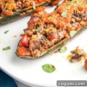 A close-up shot of a perfectly baked zucchini boat, generously stuffed with a savory ground plant-based filling, topped with rich tomato sauce, baked to perfection, and garnished with fresh herbs. It beautifully mimics the appearance of a meat-stuffed dish.