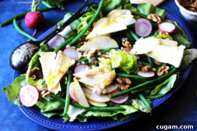 French salad on a blue serving plate, ready to be enjoyed.