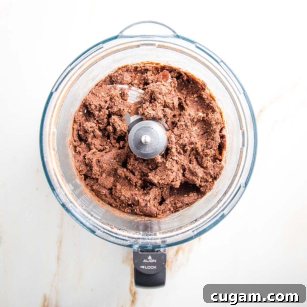 Food processor bowl filled with chocolate cookie dough
