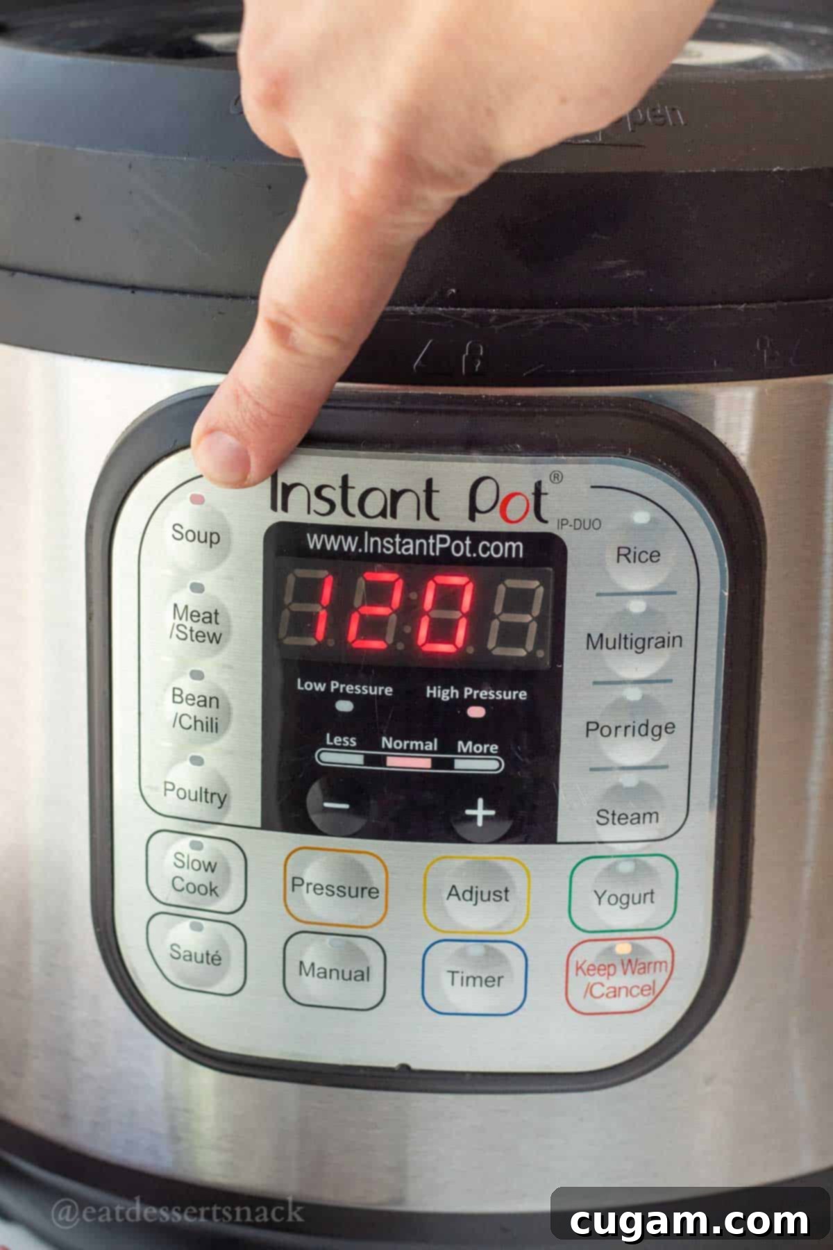 Instant Pot with lid securely in place and set to 'Sealing' mode, ready to cook chicken bone broth.