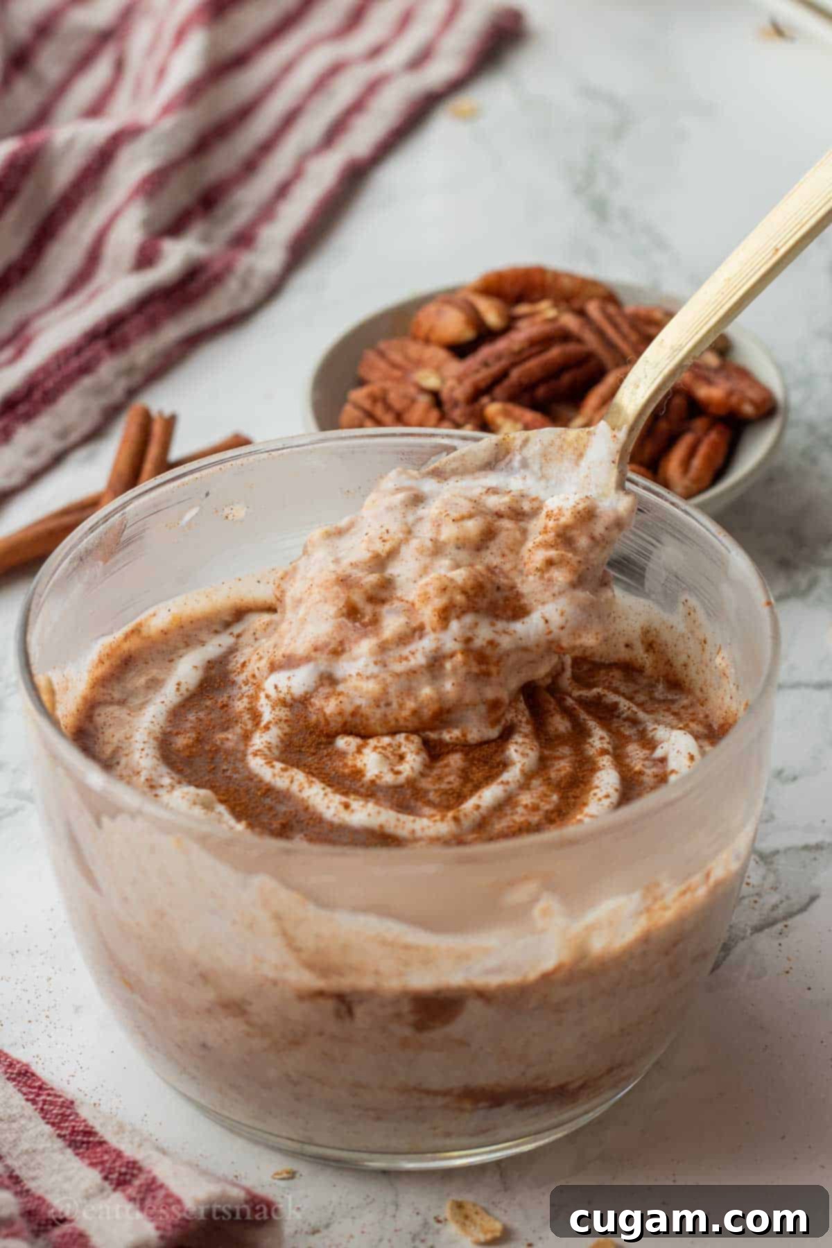 Gold spoon in cinnamon oatmeal.