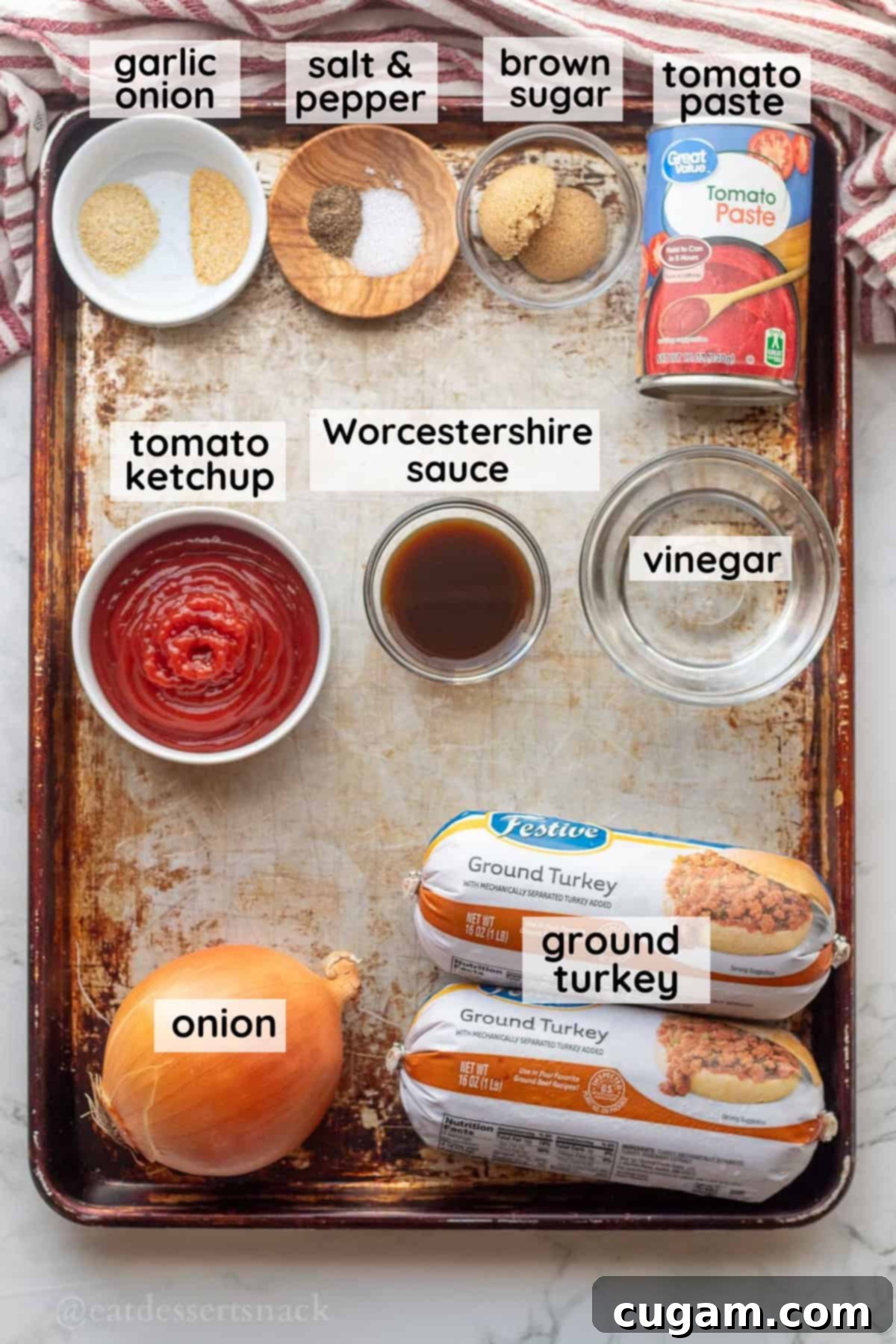 Labeled ingredients for ground turkey sloppy joes on metal pan in glass bowls.