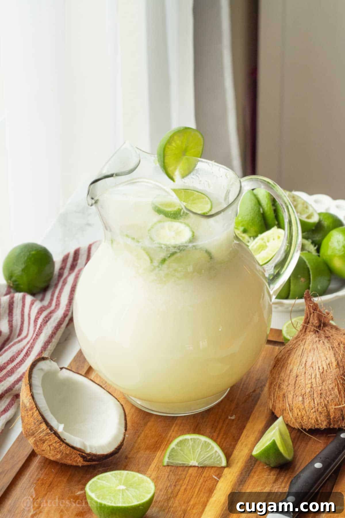 Pitcher of lime in the coconut drink.