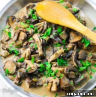 Creamy Mushroom Sauce with Wild and Cultivated Mushrooms 2 A bowl of creamy wild mushroom sauce with fresh herbs, ready to be served over your favorite dish.