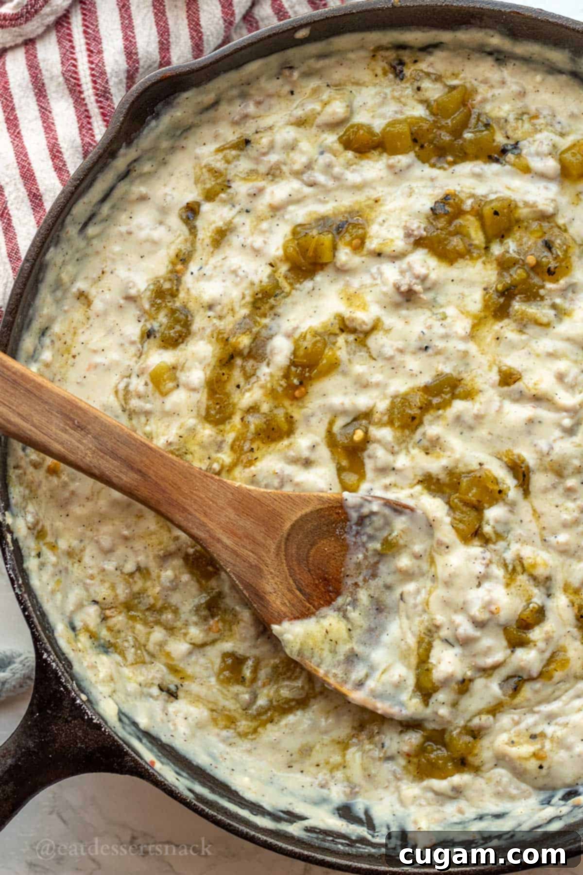 New Mexico Green Chile Sauce 9 Roasted green chiles in sausage gravy in skillet.