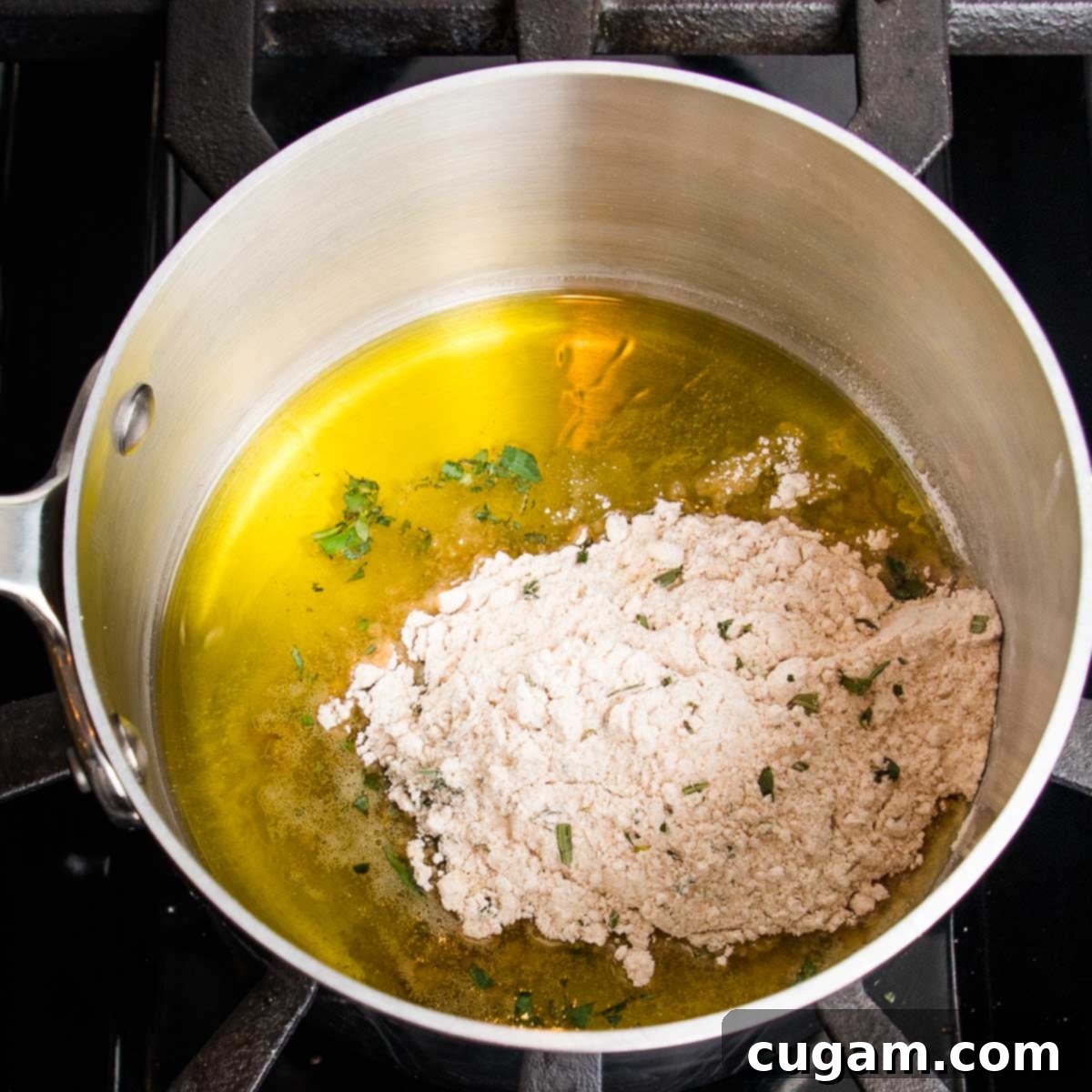 Small saucepan with olive oil, flour, herbs.