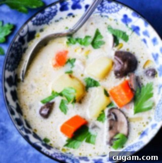 Creamy Polish Mushroom Soup with Golden Yukon Potatoes 8 Homemade mushroom chunky soup in a blue bowl