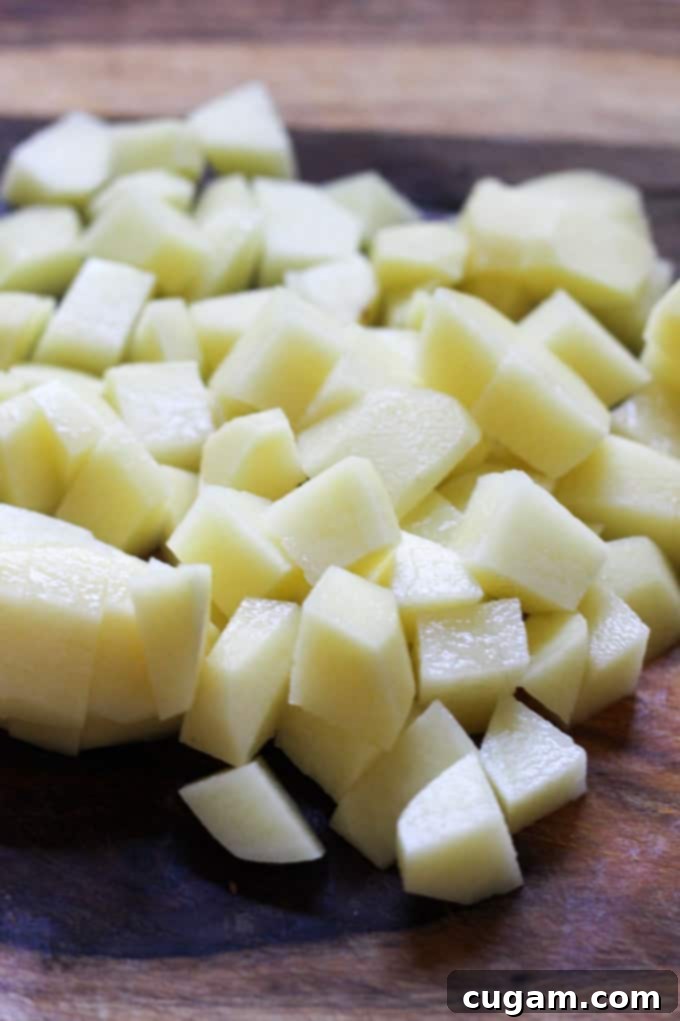 Close-up of freshly cut Yukon Gold Idaho® Potatoes, ready for cooking.