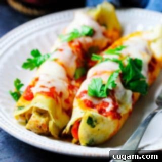 Savory Crepes with chicken and mozzarella on a plate with parsley on top