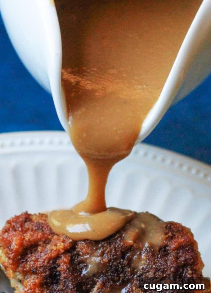 Pouring rich, smooth homemade gravy over a delicious roast for dinner