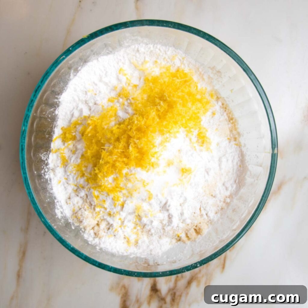 Dry ingredients for olive oil cake: almond flour, arrowroot powder and lemon zest.