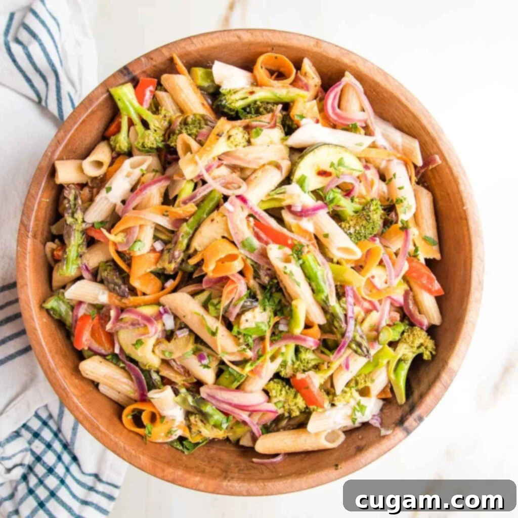 A close-up of a serving of vegan pasta primavera.