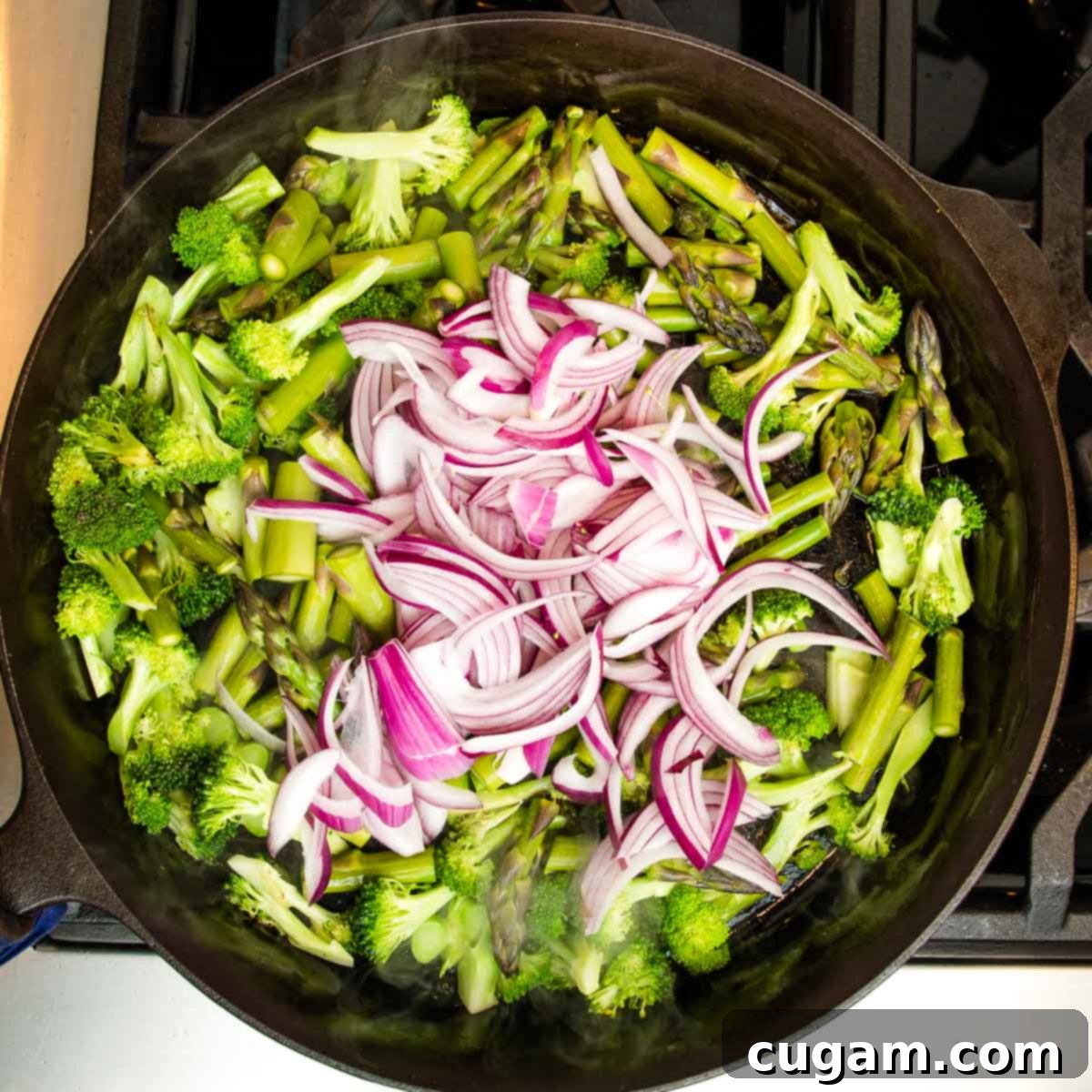 Red onion added to sautéing vegetables.
