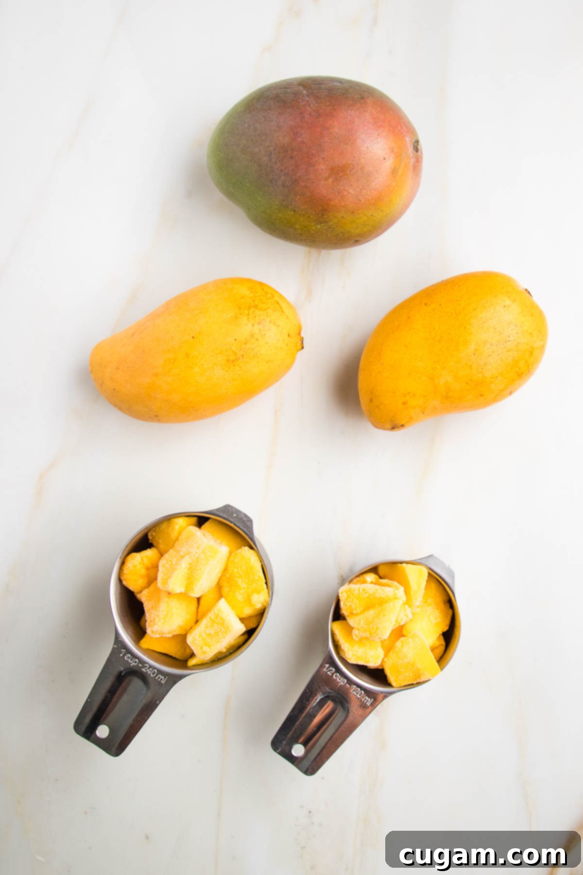 Examples of mango needed for salad dressing: one large red mango or 2 smaller ataulfo mangos, or 1 ½ cups frozen mango cubes.