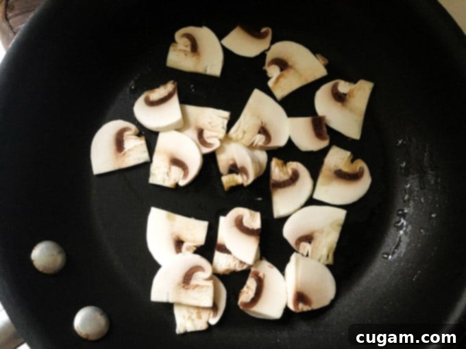 Sliced mushrooms on a pan