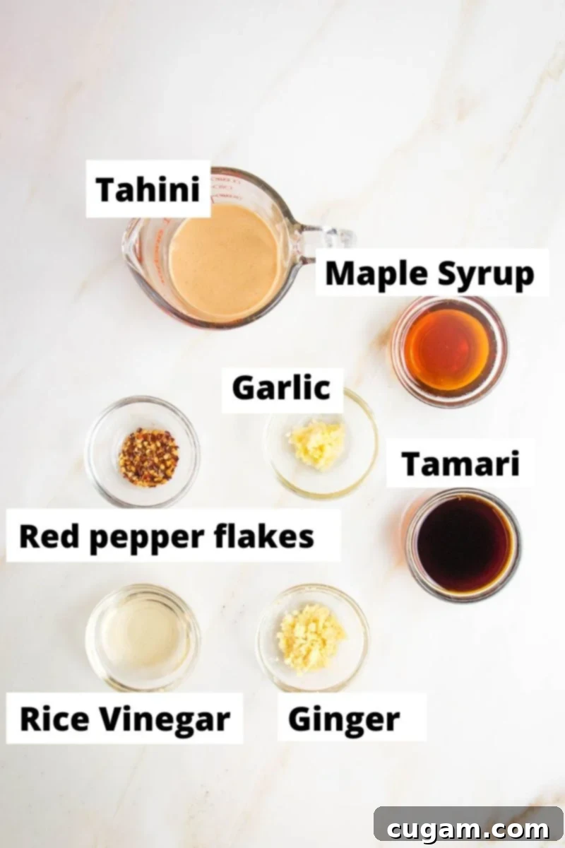 Labeled ingredients for sesame noodle sauce: tahini, maple syrup, tamari, garlic, red pepper flakes, rice vinegar, ginger.