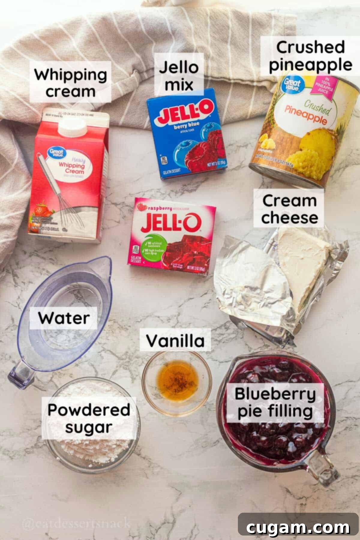 Labeled ingredients for blueberry jello salad in glass dishes on marble countertop.