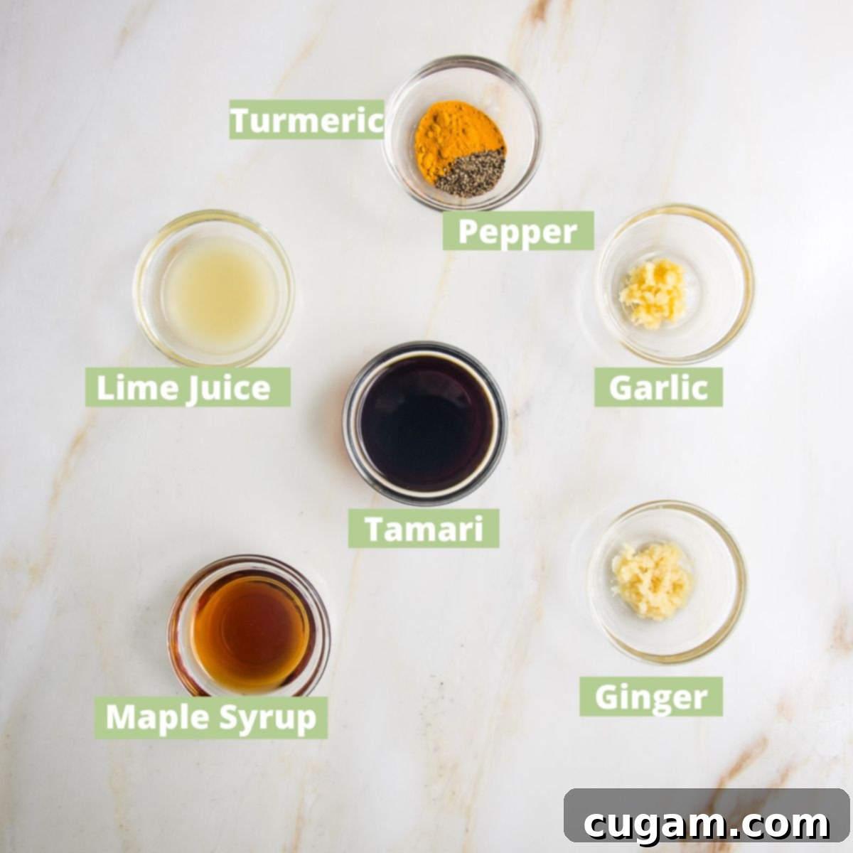 Tofu Satay Marinade ingredients labeled: turmeric, pepper, garlic, ginger, lime juice, tamari, maple syrup.