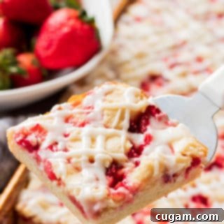 Luscious Strawberries and Cream Bars 6 Close-up of a perfectly sliced Strawberries and Cream Bar.