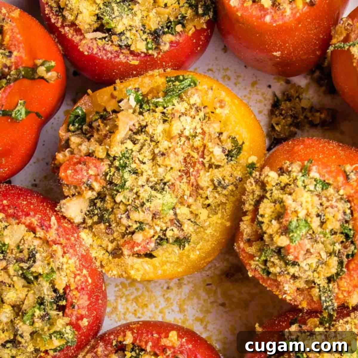 Large tomatoes, scooped out and filled with quinoa stuffing, then sprinkled with nutritional yeast.