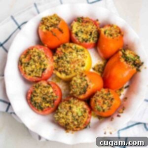 Round baking dish filled with baked stuffed tomatoes.