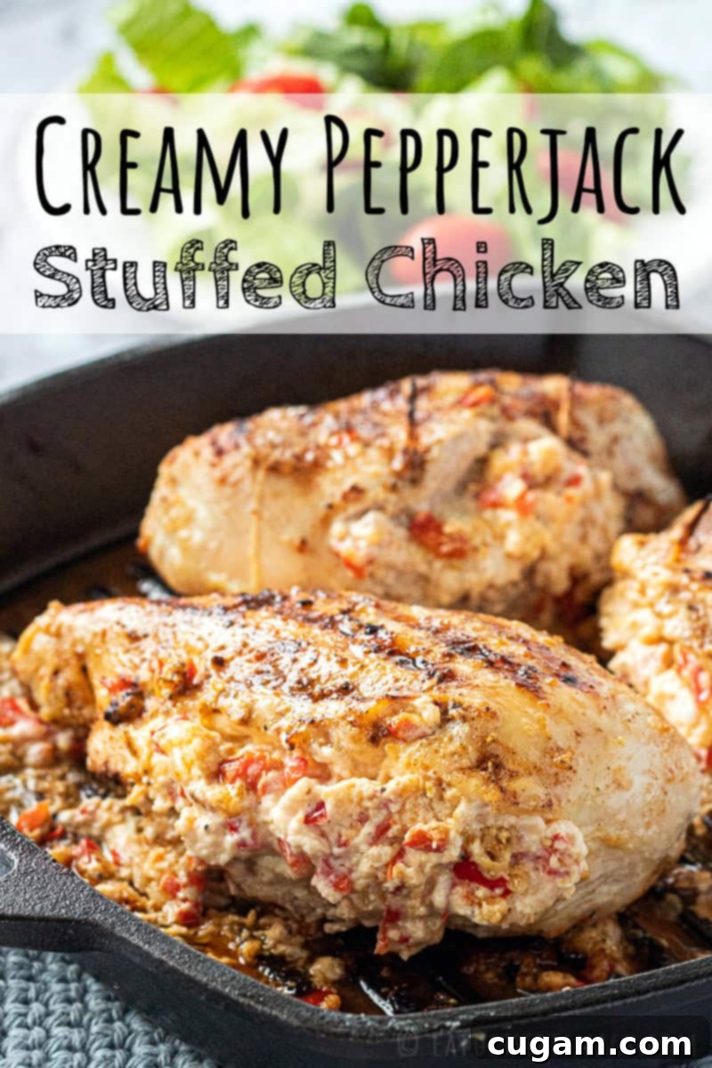 Baked Cheesy Stuffed Chicken Breast in black cast iron pan, sliced to show creamy filling, served on a plate.