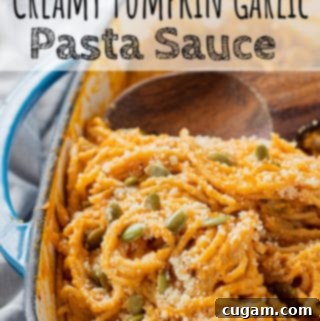 Cooked pumpkin pasta in blue pan.