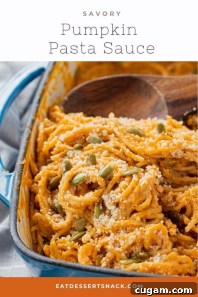 Cooked creamy pumpkin pasta sauce with noodles in a blue pan, ready for serving.