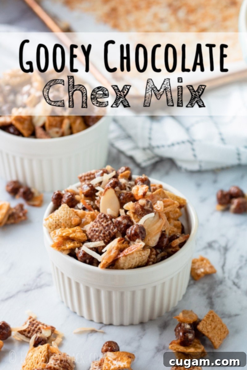 A beautifully styled white bowl overflowing with freshly made Chocolate Gooey Chex Mix, positioned on a sleek marble countertop, inviting viewers to save the recipe.