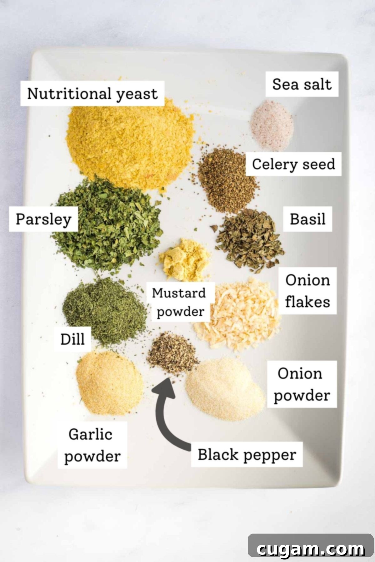 A vibrant flat lay of individual dried herbs and spices, meticulously arranged and labeled, ready to be combined into the homemade dry ranch mix.