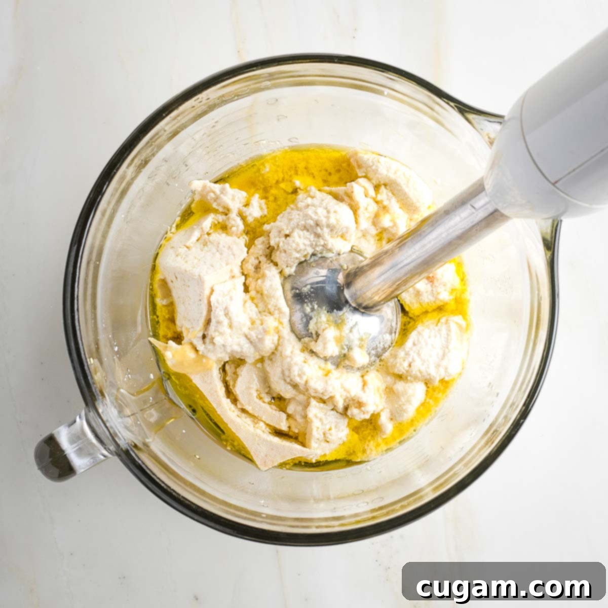 Immersion blender whipping up vegan mayo.