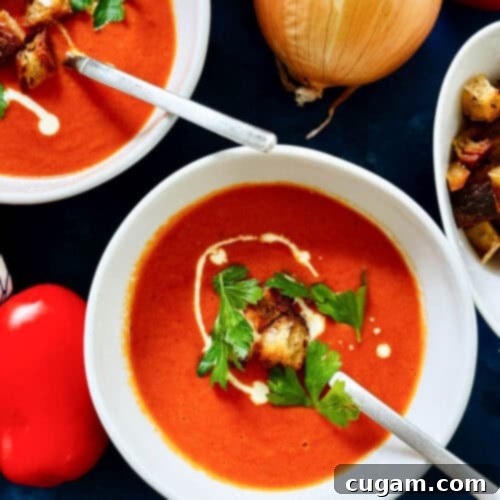 Oven Roasted Tomato Soup in a bowl with spoon