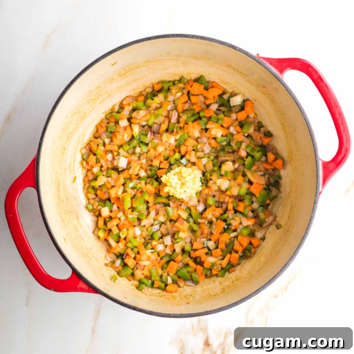 Sauteed vegetables in a dutch oven.