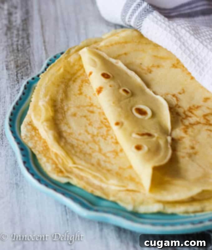 Perfect French Crepes, thin and golden, ready for sweet or savory fillings.