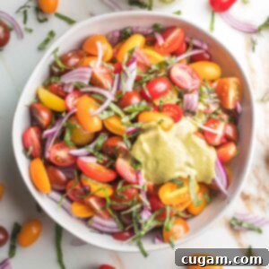 Chopped fresh tomatoes with red onion and fresh basil and a creamy balsamic vinaigrette.