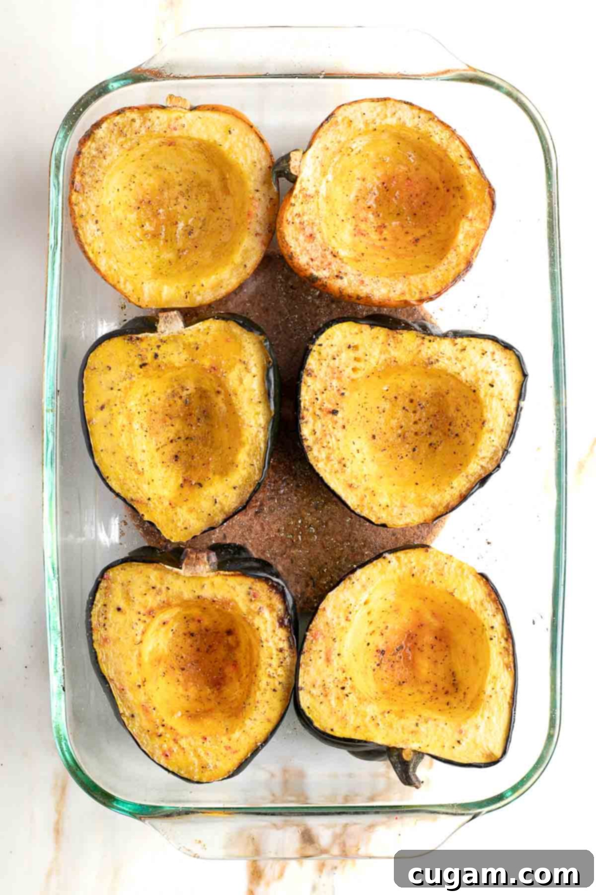 Roasted acorn squash halves, fork-tender and ready to be stuffed.