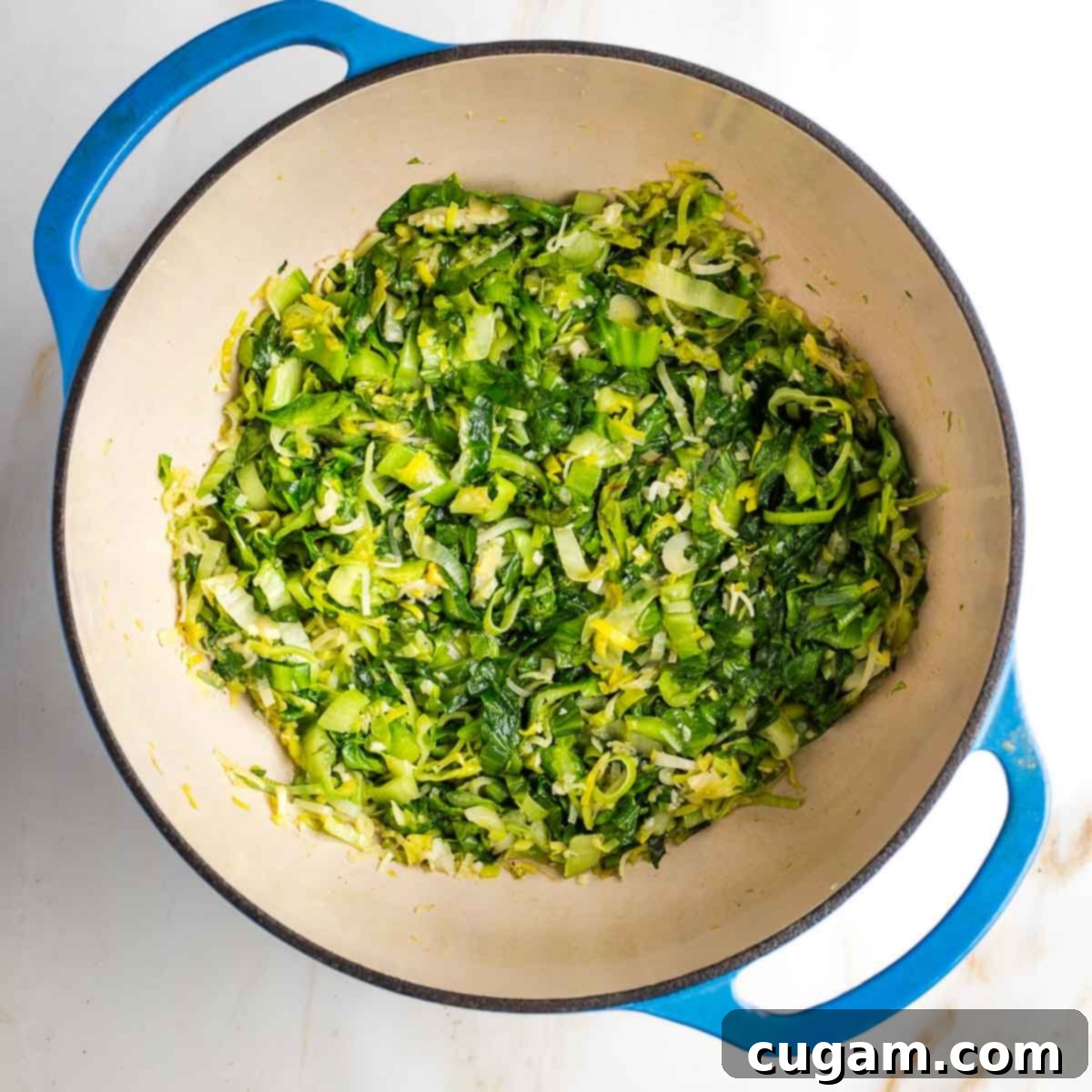 Wilted greens at the bottom of a dutch oven.