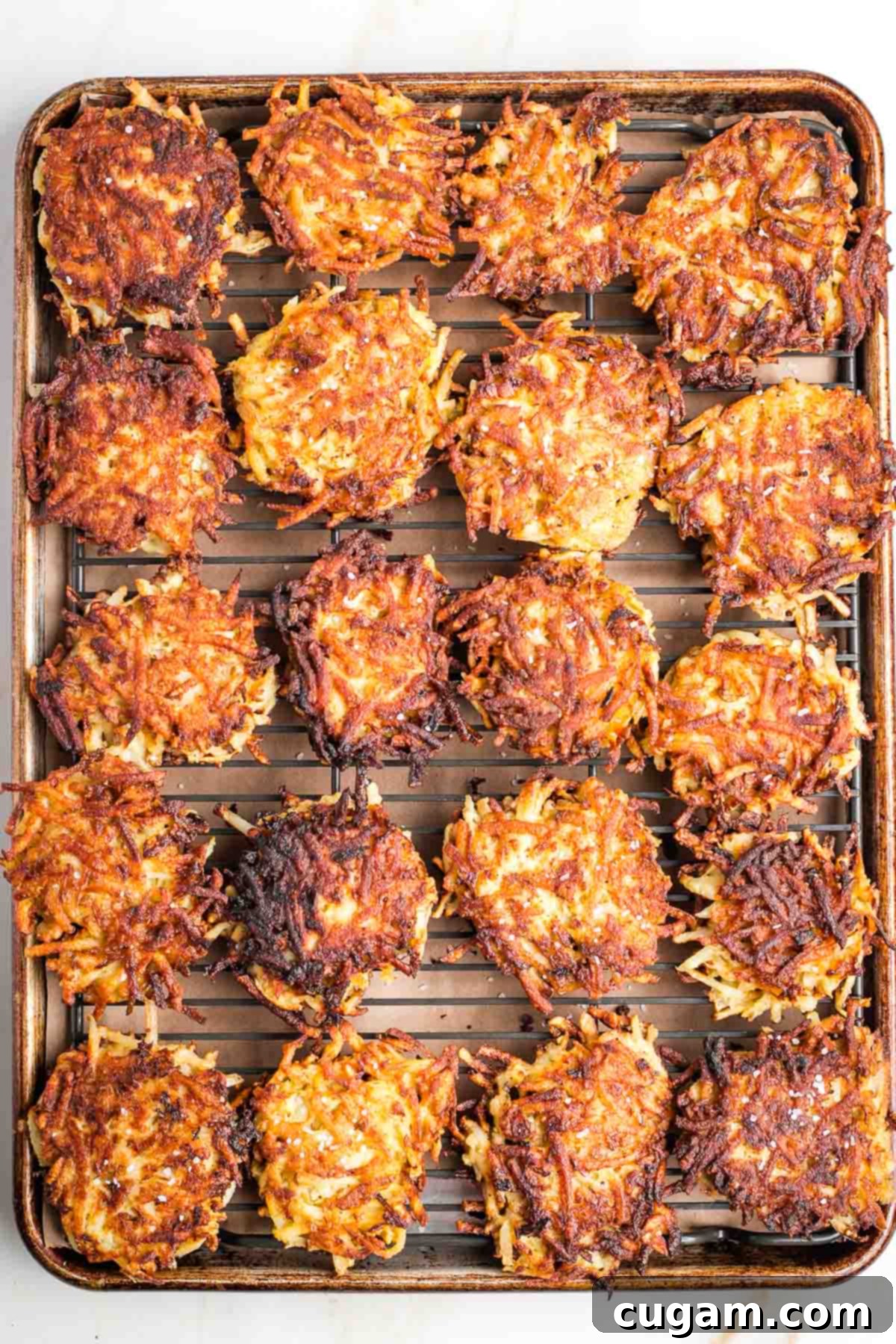Grandma's Secret Potato Latkes 13 A platter of golden-brown potato latkes.