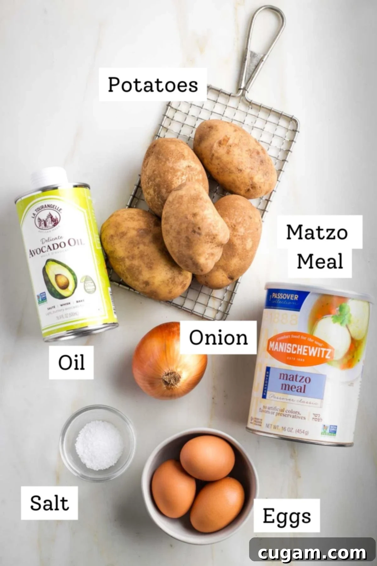 Grandma's Secret Potato Latkes 3 Assortment of fresh ingredients for potato latkes, including potatoes, onions, eggs, and matzo meal.