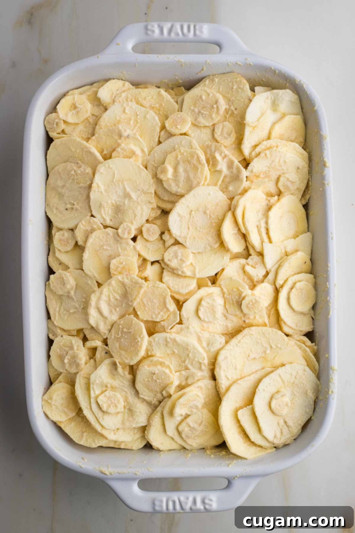 Layers of thinly sliced parsnips.