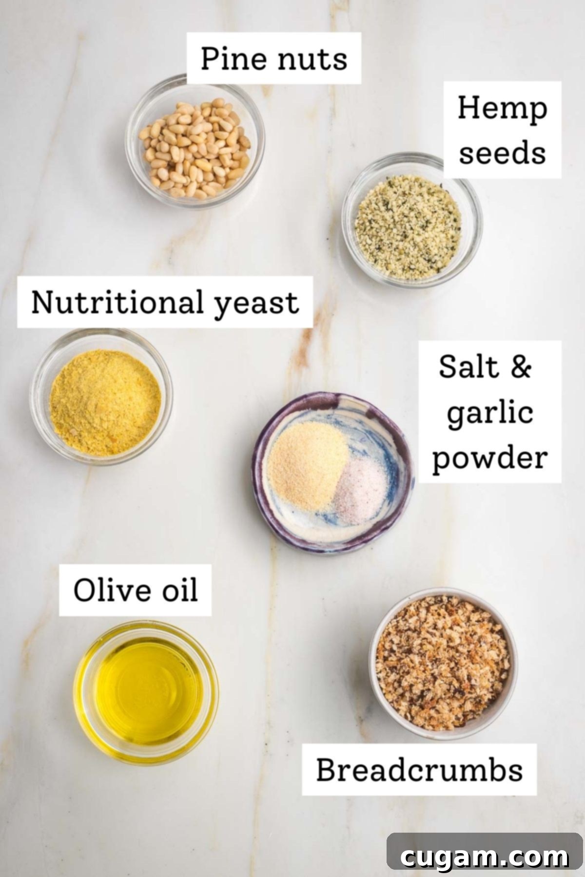 Labeled ingredients: pine nuts, hemp seeds, nutritional yeast, garlic powder, olive oil, breadcrumbs.