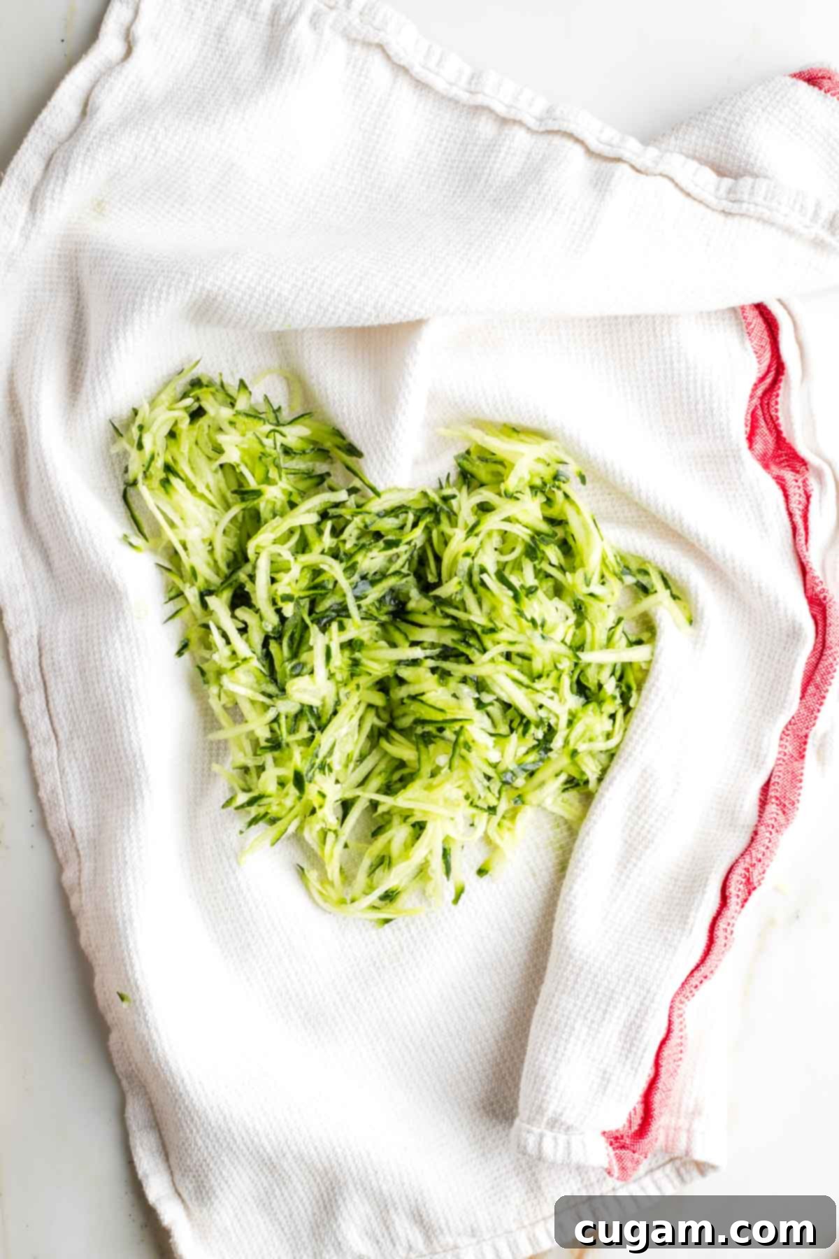 Grated cucumber on a dish towel. 