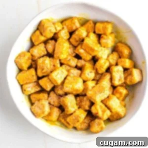 Cubes of crispy tofu, coated in a sticky orange glaze.