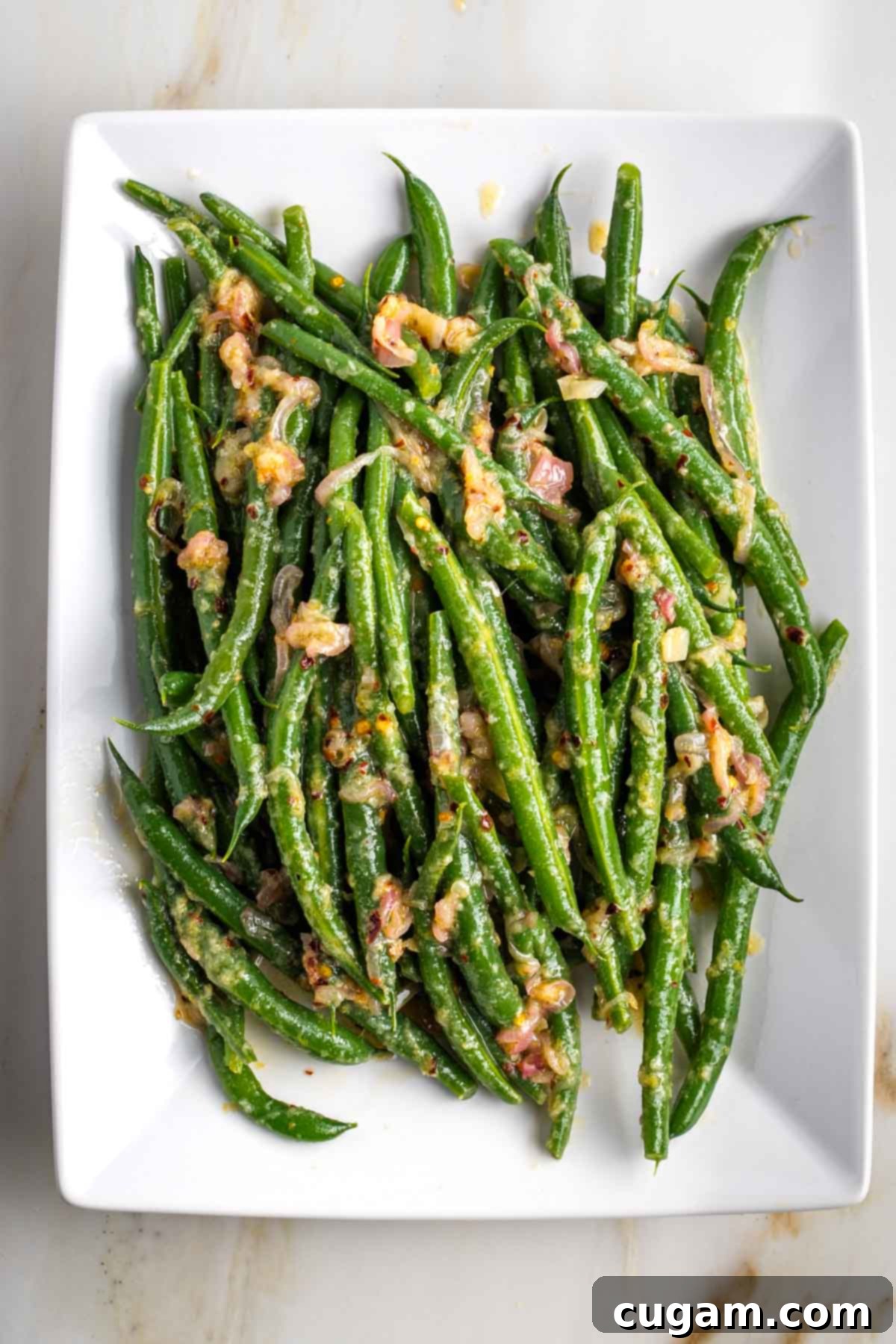 Bright green beans with shallots and lemon vinaigrette.