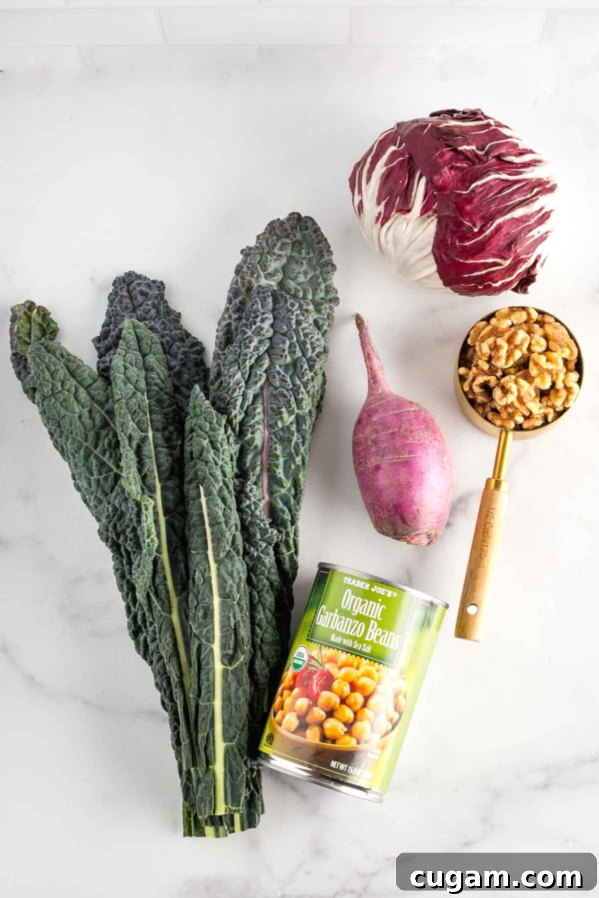 Vibrant Radicchio Chickpea Salad with Tahini 3 Ingredients for chopped salad: elephant kale, radicchio, purple daikon radish, walnuts and canned chickpeas.